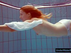 KiloVideos presents: Redhead in a white dress and sexy bikini