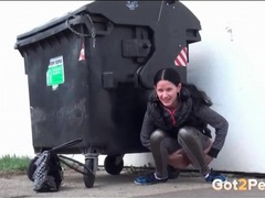 KiloVideos presents: Shiny leggings on a cutie going pee in public