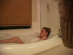 KiloVideos presents: Hidden camera captures girl masturbating in bathtub