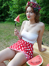 KiloVideos presents: Nice belarusian stunner Rokki removes all clothes on a blanket in a backyard